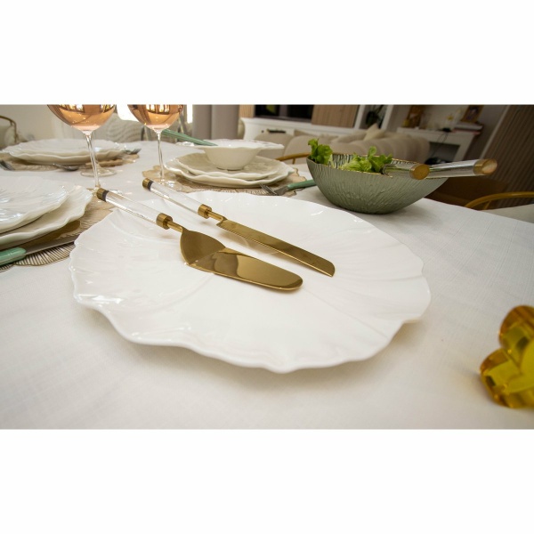 Gouden taart en messchop met transparant handvat